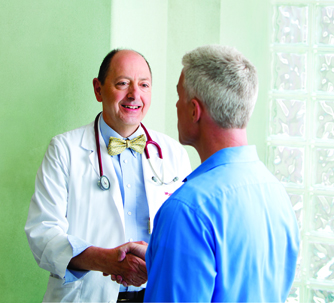 physician and patient shaking hands